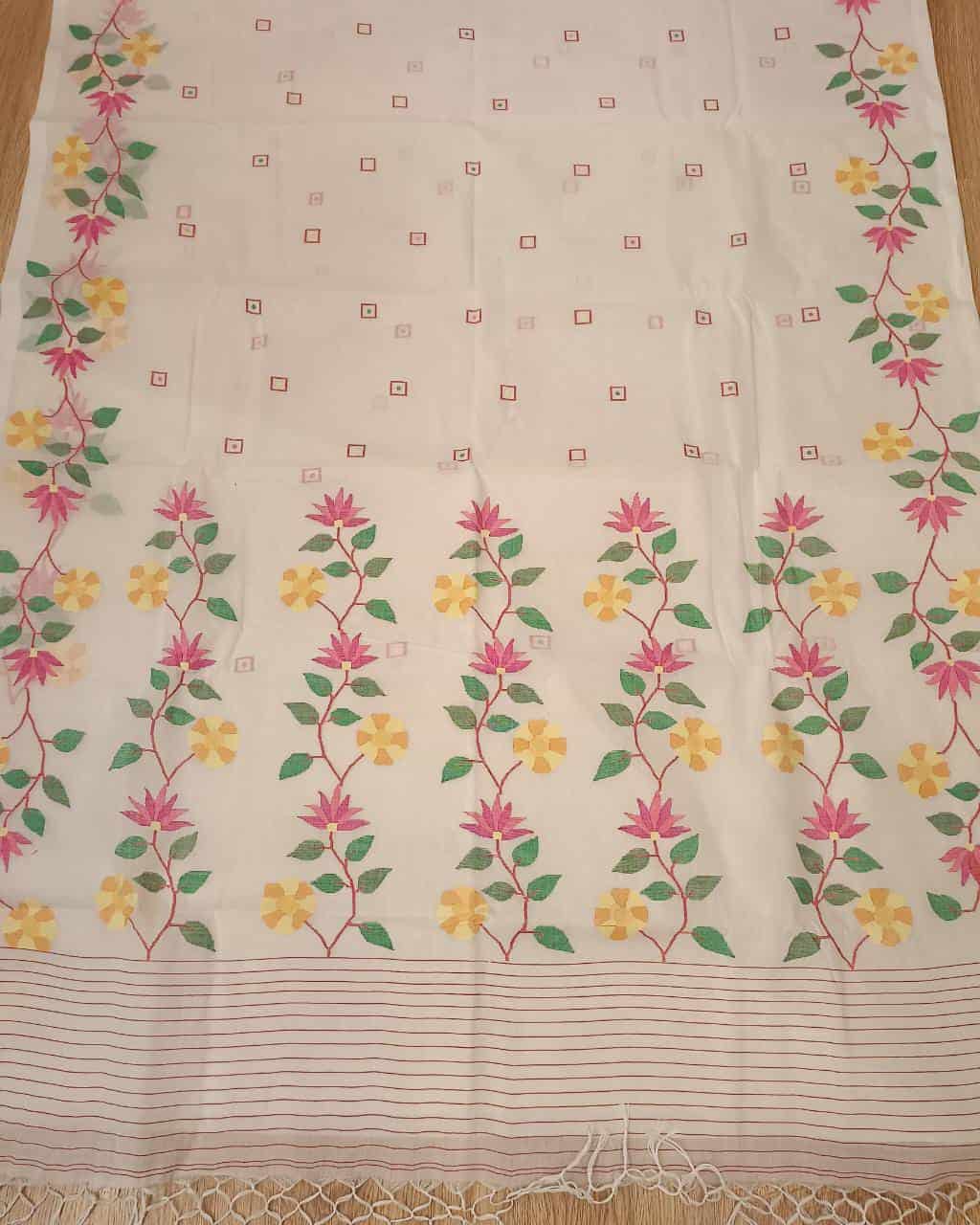 Pure Cotton handwoven jamdani saree in White & Multi Colour with a beautiful delicate & intricate floral weave on border & Aanchal. Geometric motifs woven all over the body. Blouse piece included.