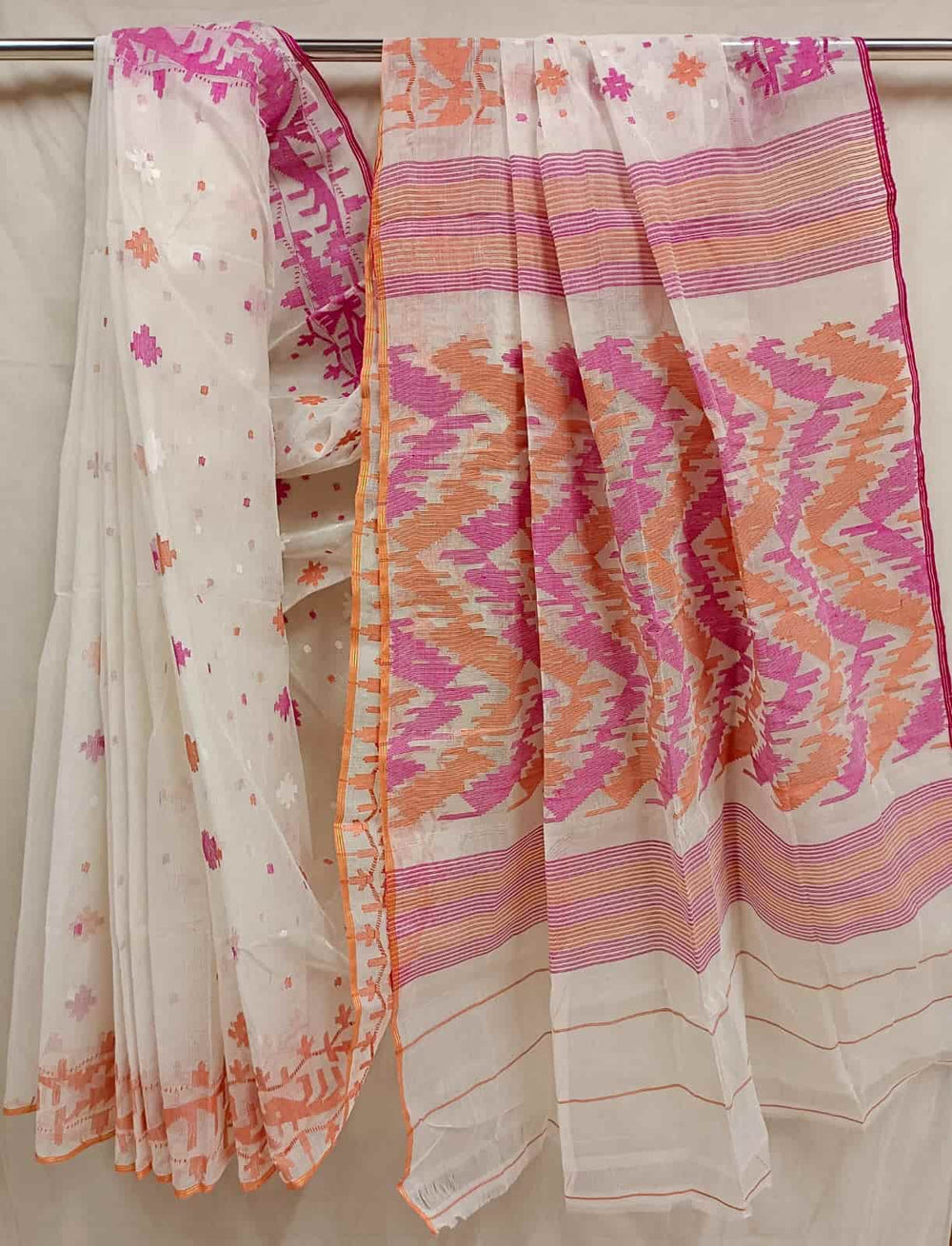 Off-white,  Bangladeshi handwoven cotton jamdani saree with all-over Orange & pink woven booties on body and orange & pink Ganga Jamuna Traditional Jamdani woven border and Aanchal.