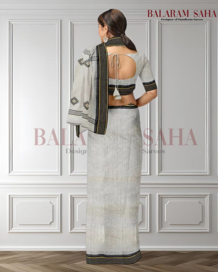 Balaram Saha's White and Black Handloom Cotton Saree (handloom saree, cotton saree, handloom cotton saree, balaram saha online, handloom sarees, balaram saha handloom saree store photos, balaram saha handloom saree store, cotton handloom saree, bengal handloom sarees, pure cotton, cotton saree for women, cotton saree online)   https://medium.com/