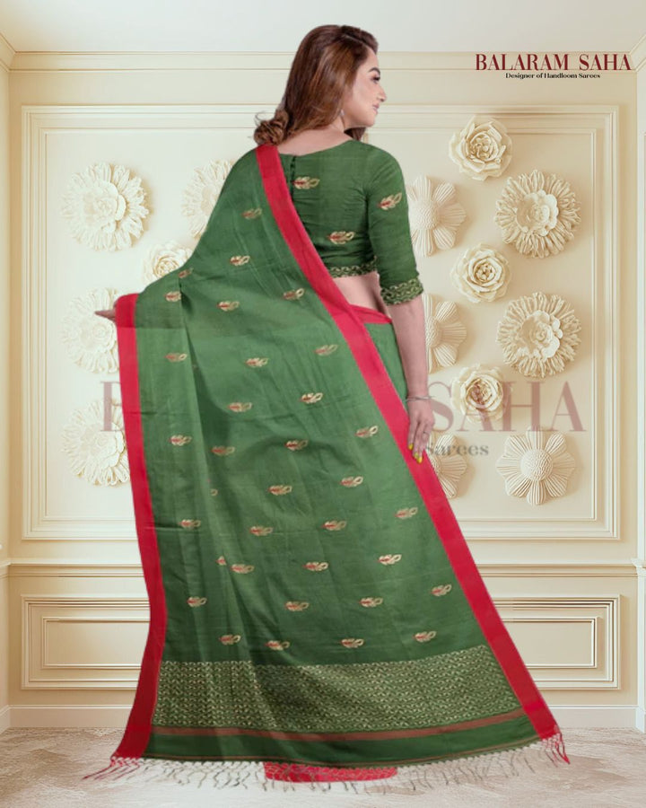 Green Soft & Fine Handloom Cotton Saree With Red Border Of Balaram Saha (handloom saree, cotton saree, handloom cotton saree, balaram saha online, handloom sarees, balaram saha handloom saree store photos, balaram saha handloom saree store, cotton handloom saree, bengal handloom sarees, pure cotton, Zari border, handloom cotton saree with zari border, soft cotton saree with zari border, cotton saree for women, cotton saree online)  https://elements.envato.com/