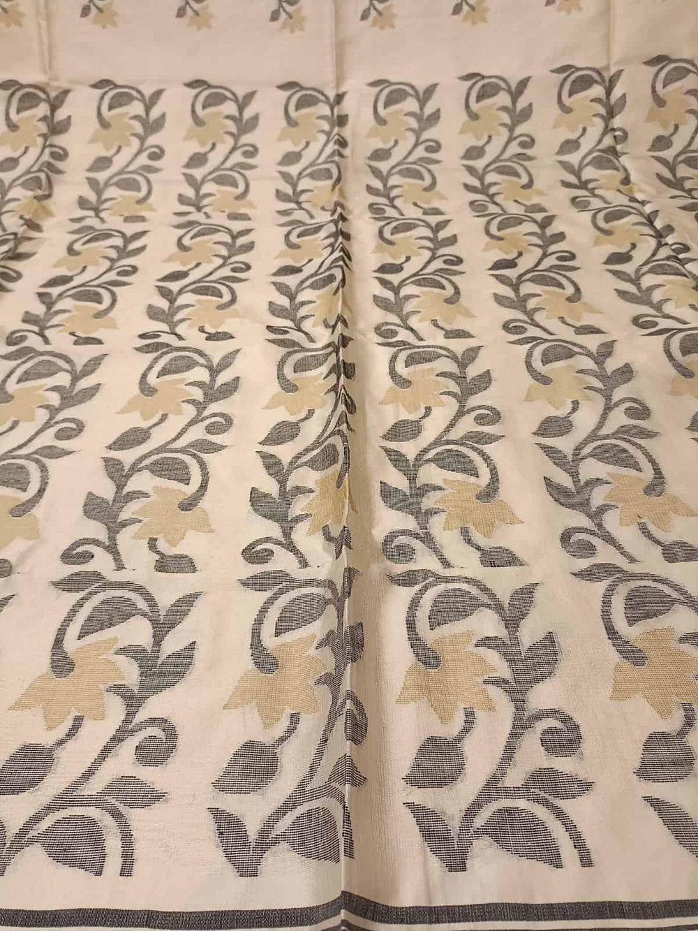 Off White & Black/Beige, Katan Silk Jamdani saree with floral weave on border & Aanchal. Floral motifs woven all over the body.  Blouse Piece included.