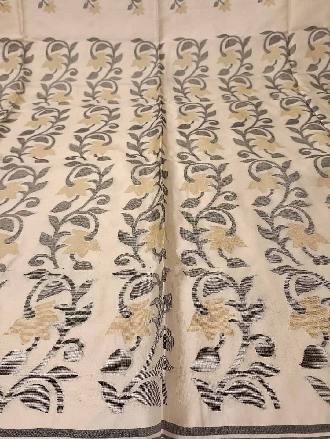 Off White & Black/Beige, Katan Silk Jamdani saree with floral weave on border & Aanchal. Floral motifs woven all over the body.  Blouse Piece included.