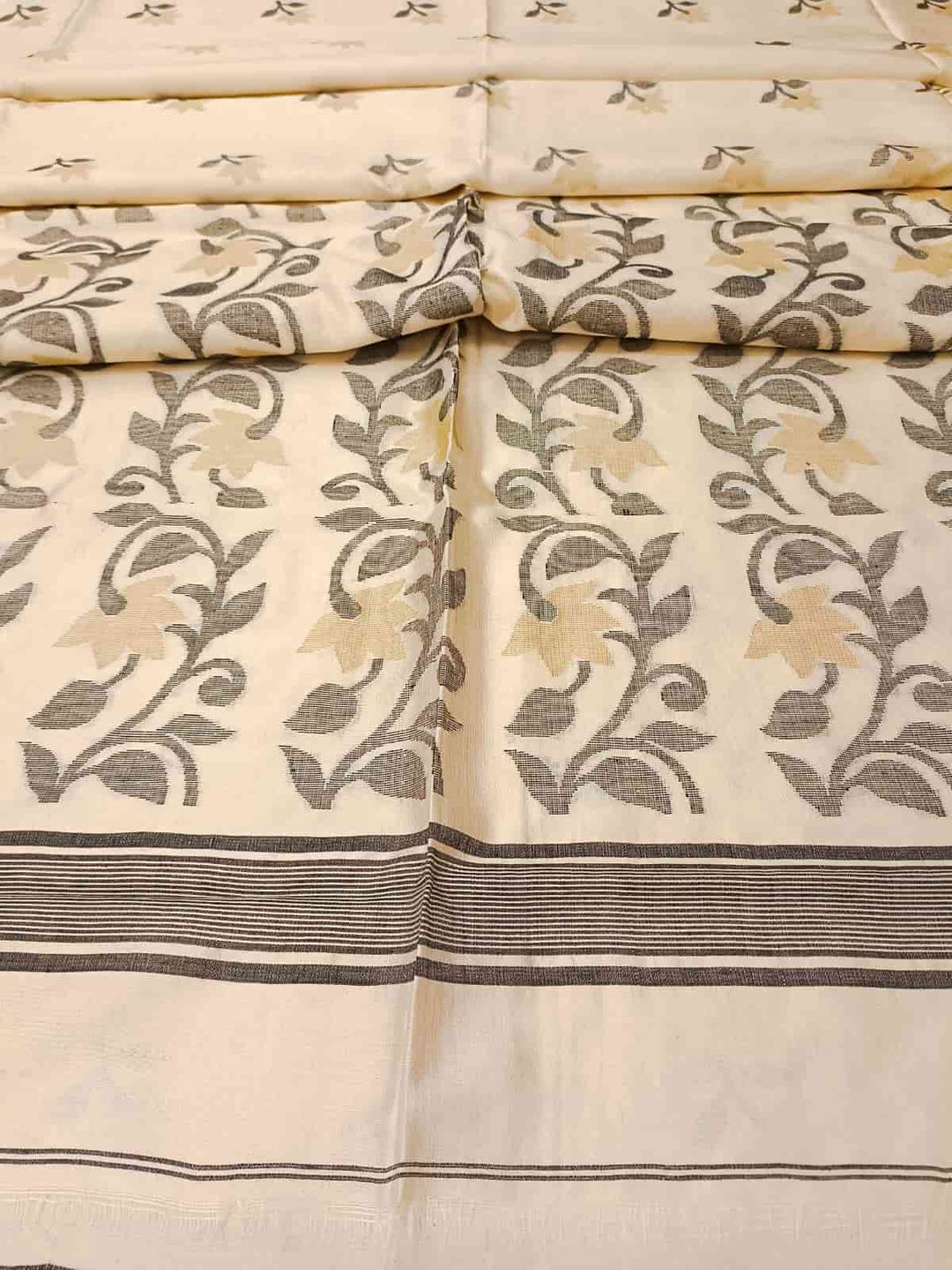 Off White & Black/Beige, Katan Silk Jamdani saree with floral weave on border & Aanchal. Floral motifs woven all over the body.  Blouse Piece included.