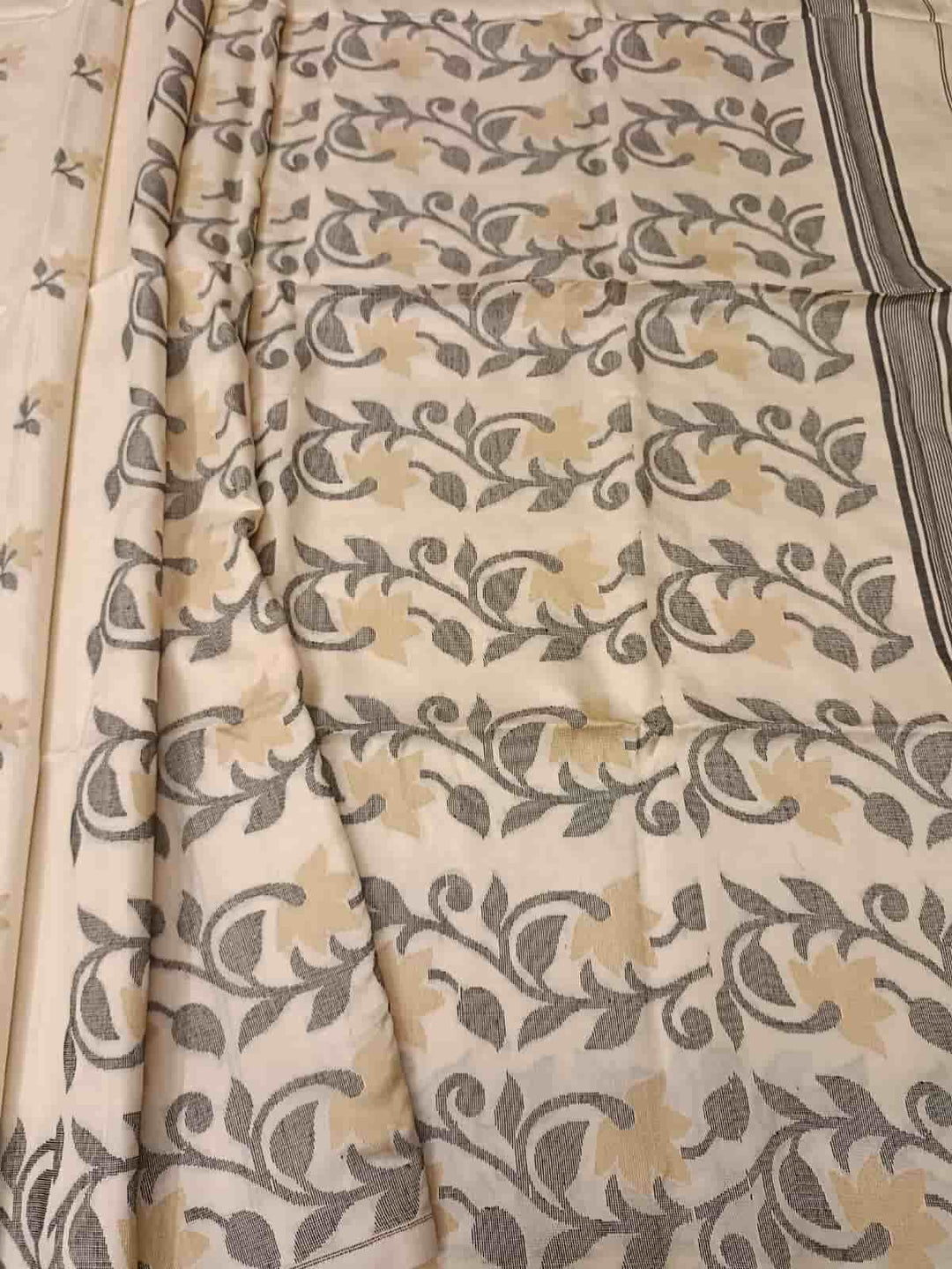 Off White & Black/Beige, Katan Silk Jamdani saree with floral weave on border & Aanchal. Floral motifs woven all over the body.  Blouse Piece included.