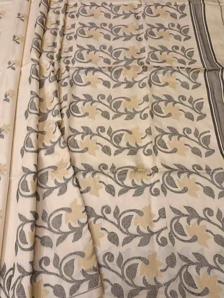 Off White & Black/Beige, Katan Silk Jamdani saree with floral weave on border & Aanchal. Floral motifs woven all over the body.  Blouse Piece included.