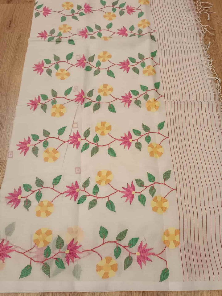 Pure Cotton handwoven jamdani saree in White & Multi Colour with a beautiful delicate & intricate floral weave on border & Aanchal. Geometric motifs woven all over the body. Blouse piece included.