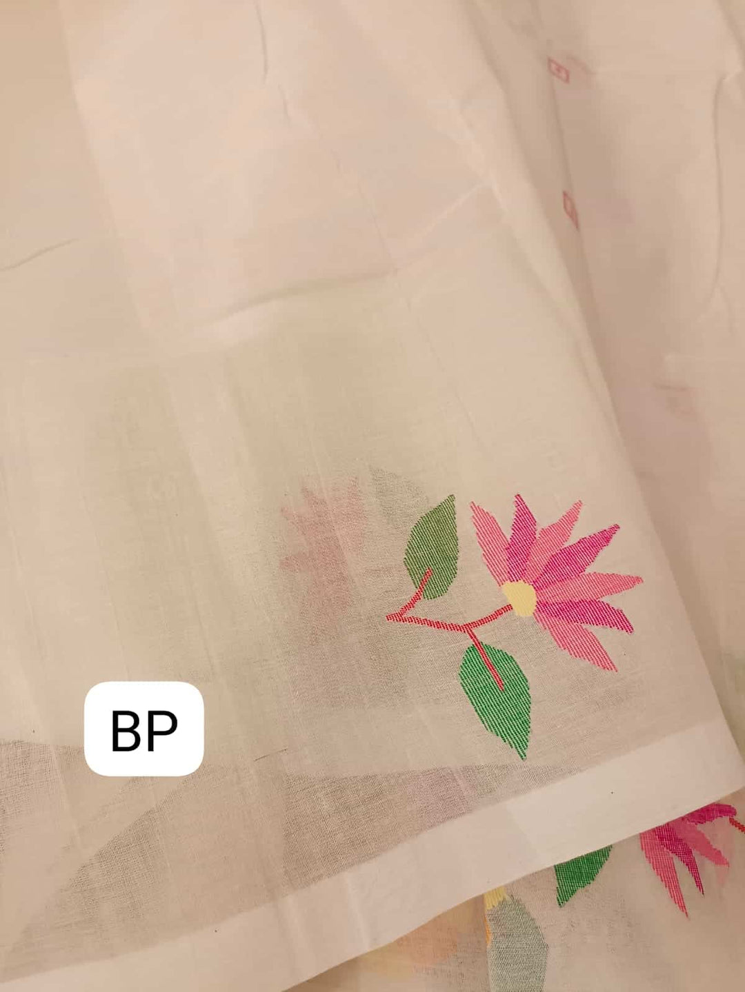 Pure Cotton handwoven jamdani saree in White & Multi Colour with a beautiful delicate & intricate floral weave on border & Aanchal. Geometric motifs woven all over the body. Blouse piece included.
