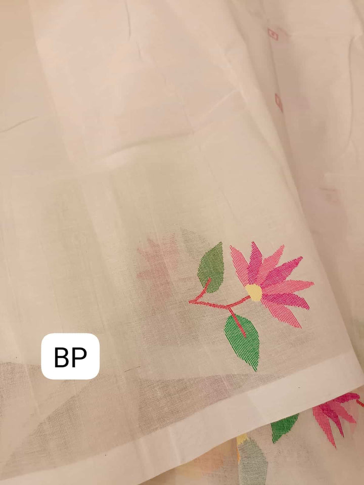Pure Cotton handwoven jamdani saree in White & Multi Colour with a beautiful delicate & intricate floral weave on border & Aanchal. Geometric motifs woven all over the body. Blouse piece included.