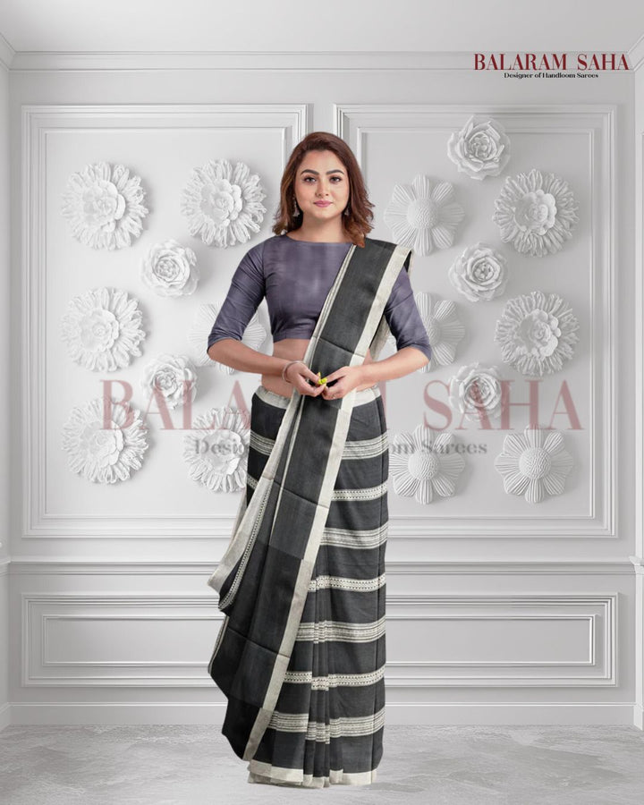 Bold & Beautiful: Balaram Saha's Black & White Soft Handloom Dhonekali Saree (handloom saree, cotton saree, handloom cotton saree, balaram saha online, handloom sarees, balaram saha handloom saree store photos, balaram saha handloom saree store, cotton handloom saree, bengal handloom sarees, pure cotton, cotton saree for women, cotton saree online)  https://traveltriangle.com/blog/kolkata/