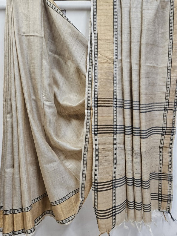 Cream Handloom Tussar Silk Saree with Gold Zari & Black Border by Balaram Saha - (handloom saree, silk saree, handloom silk saree, balaram saha online, silk sarees, silk handloom saree, bengal handloom sarees, pure silk, tussar silk saree, pure tussar silk sarees, tussar silk sarees, silk saree online)    https://www.ndtv.com/