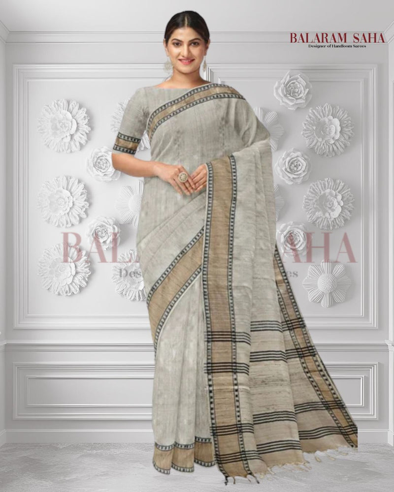 Cream Handloom Tussar Silk Saree with Gold Zari & Black Border by Balaram Saha - (handloom saree, silk saree, handloom silk saree, balaram saha online, silk sarees, silk handloom saree, bengal handloom sarees, pure silk, tussar silk saree, pure tussar silk sarees, tussar silk sarees, silk saree online)     https://www.hindustantimes.com/