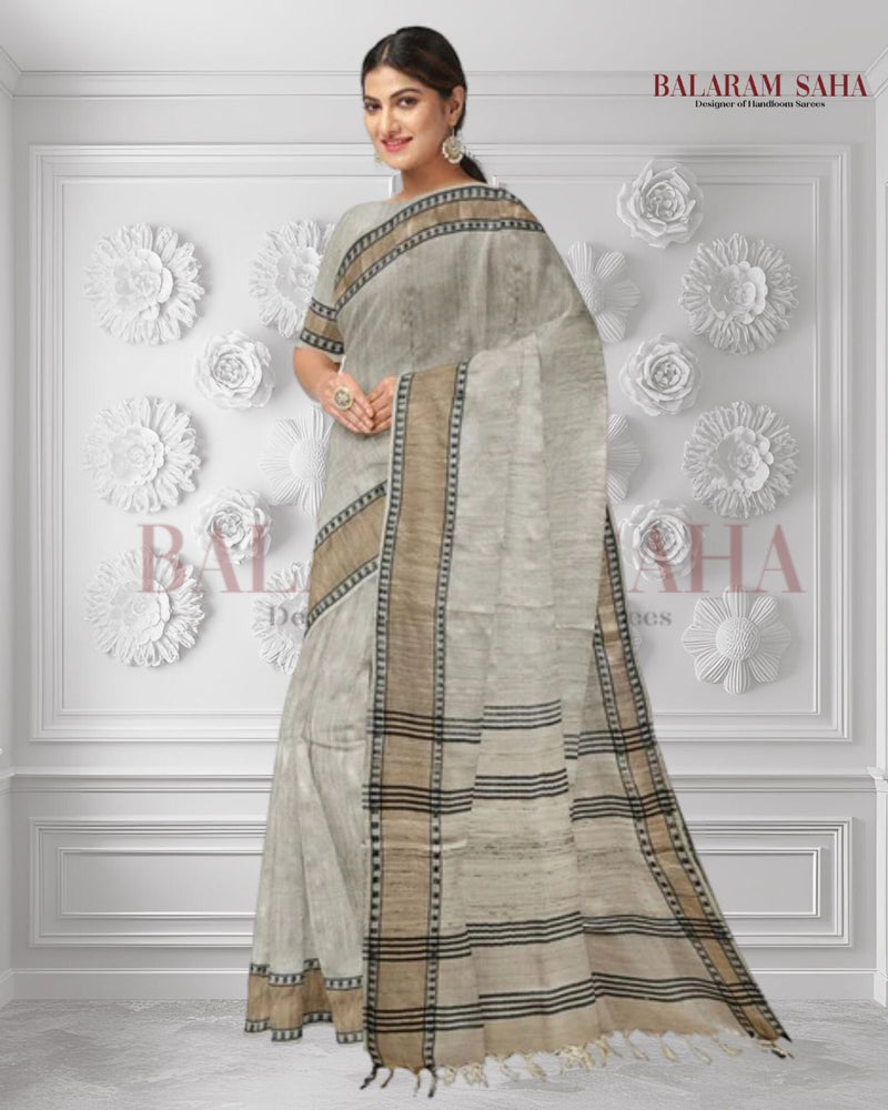 Cream Handloom Tussar Silk Saree with Gold Zari & Black Border by Balaram Saha - (handloom saree, silk saree, handloom silk saree, balaram saha online, silk sarees, silk handloom saree, bengal handloom sarees, pure silk, tussar silk saree, pure tussar silk sarees, tussar silk sarees, silk saree online)   https://www.newyorker.com/