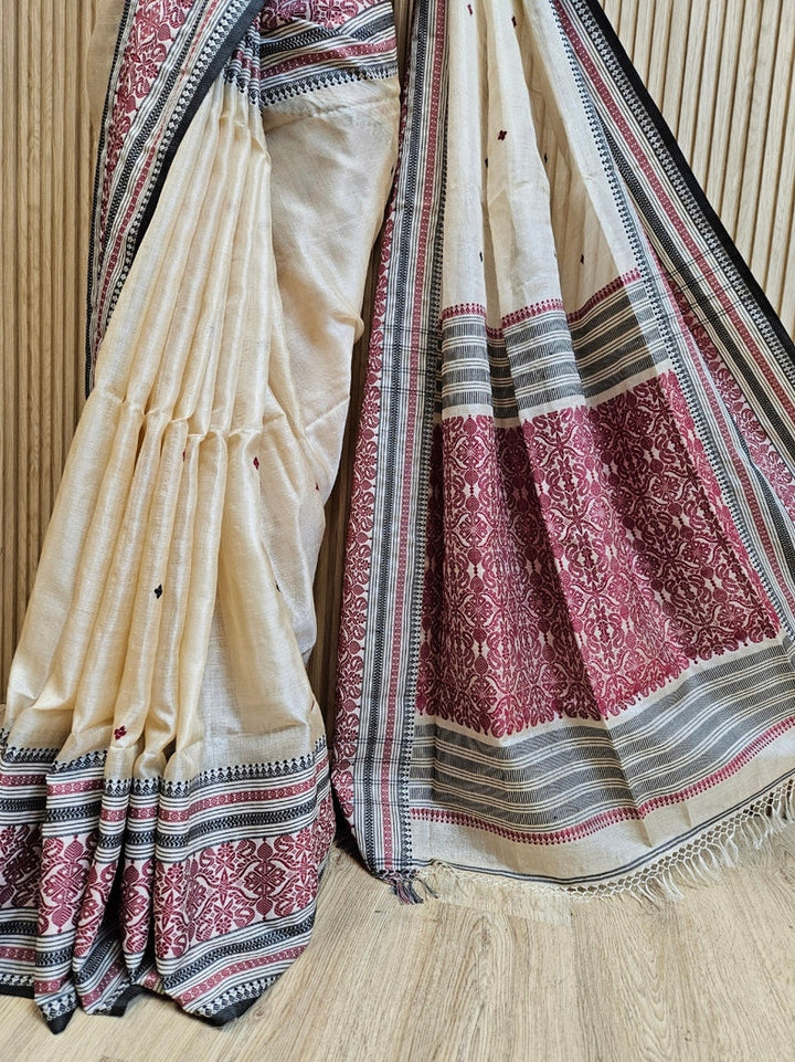 Beige Handloom Tussar Silk Saree with Black & Maroon Contrast Woven Border and Aanchal Balaram Saha