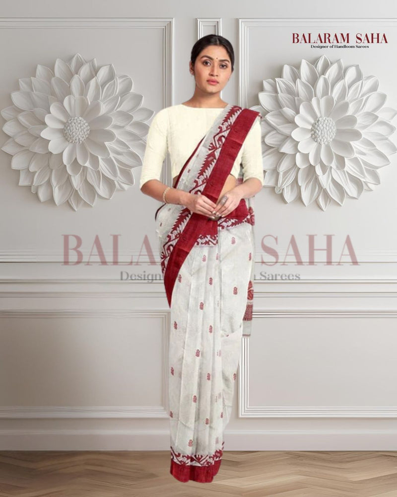 White & Red Handloom Tradition Tangail Cotton Saree By Balaram Saha - (handloom saree, cotton saree, handloom cotton saree, balaram saha online, handloom sarees, balaram saha handloom saree store photos, balaram saha handloom saree store, cotton handloom saree, bengal handloom sarees, pure cotton, cotton saree for women, cotton saree online)   https://www.pbs.org/