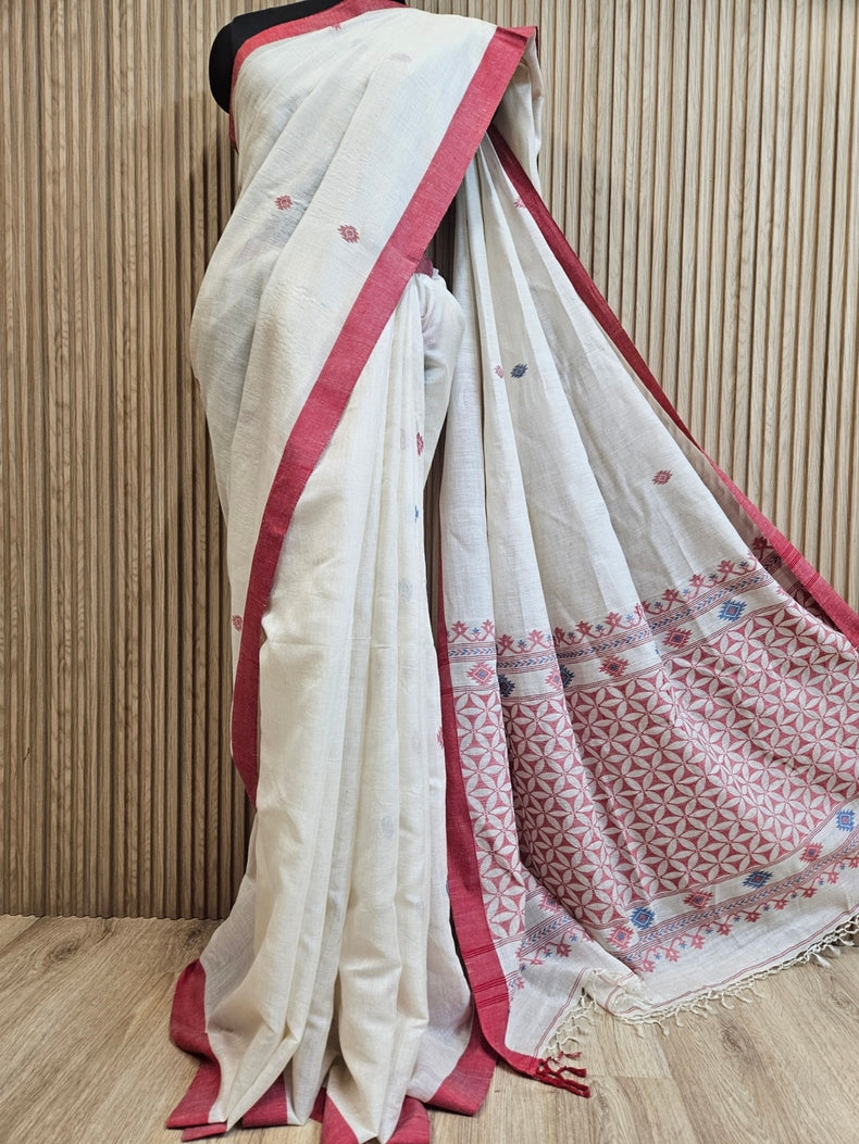 Off-White Tussar Silk Saree Features a Sriking Red Contrast Plain Border Balaram Saha