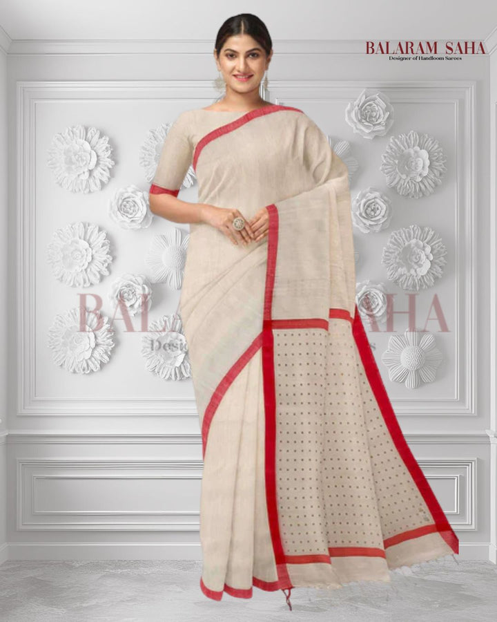 Introducing this elegant off-white and red handloom saree crafted from fine Matka silk and featuring a red satin plain border with subtly woven siqueen on the anchal and blouse. This saree is perfect for any formal occasion and is sure to make you stand out.