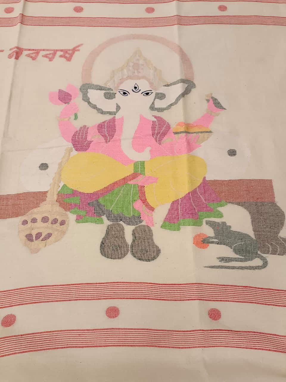Shubho Nobo Borsho Special Saree: Handspun & Handwoven soft cotton saree in White & Red with goddess Lakshmi & Lord Ganesh handwoven on the Aanchal. All over the body Polka Dot weave. Blouse Piece.