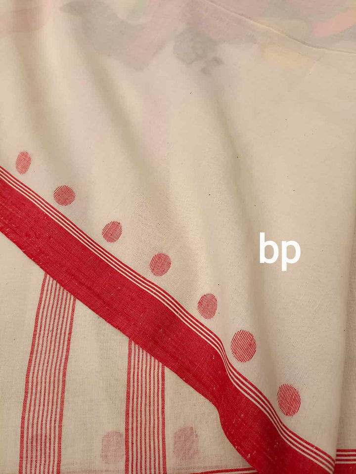 Shubho Nobo Borsho Special Saree: Handspun & Handwoven soft cotton saree in White & Red with goddess Lakshmi & Lord Ganesh handwoven on the Aanchal. All over the body Polka Dot weave. Blouse Piece.