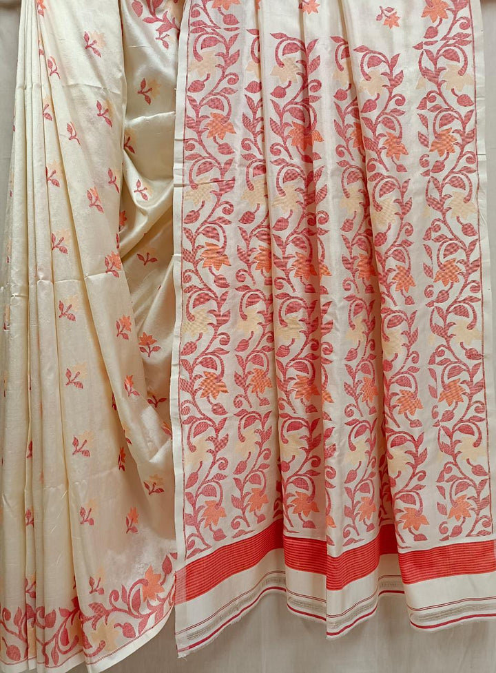 Off White & Red/Orange, Katan Silk Jamdani saree with floral weave on border & Aanchal. Floral motifs woven all over the body.  Blouse Piece included.
