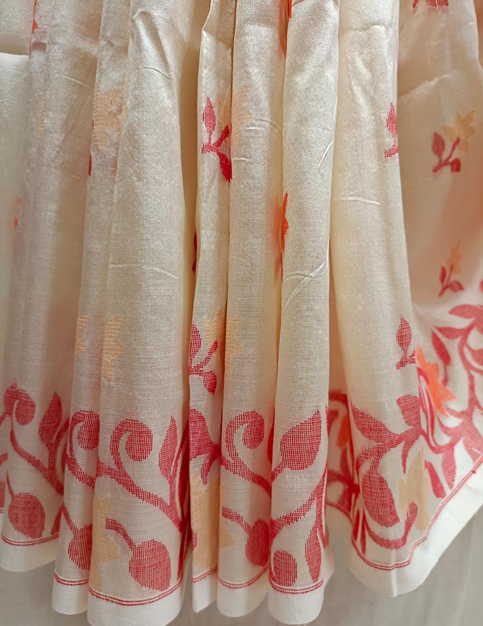 Off White & Red/Orange, Katan Silk Jamdani saree with floral weave on border & Aanchal. Floral motifs woven all over the body.  Blouse Piece included.